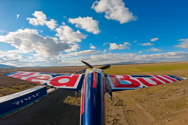 Red Bull Pilot Successfully Lands and Takes Off from Moving Train in Single Session
