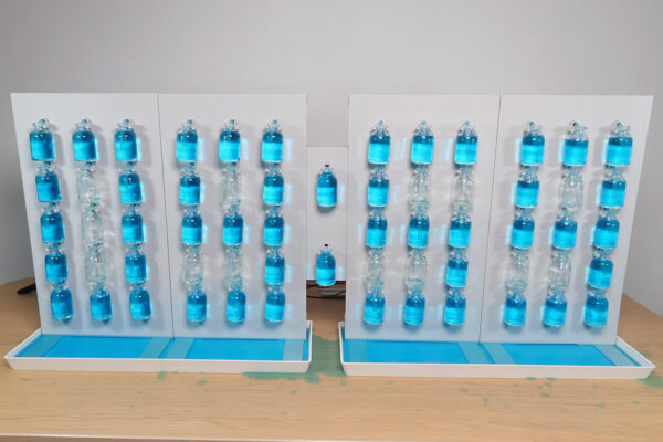 Bottles of Blue Water Spell Out Every Passing Minute on This Unique Digital Clock